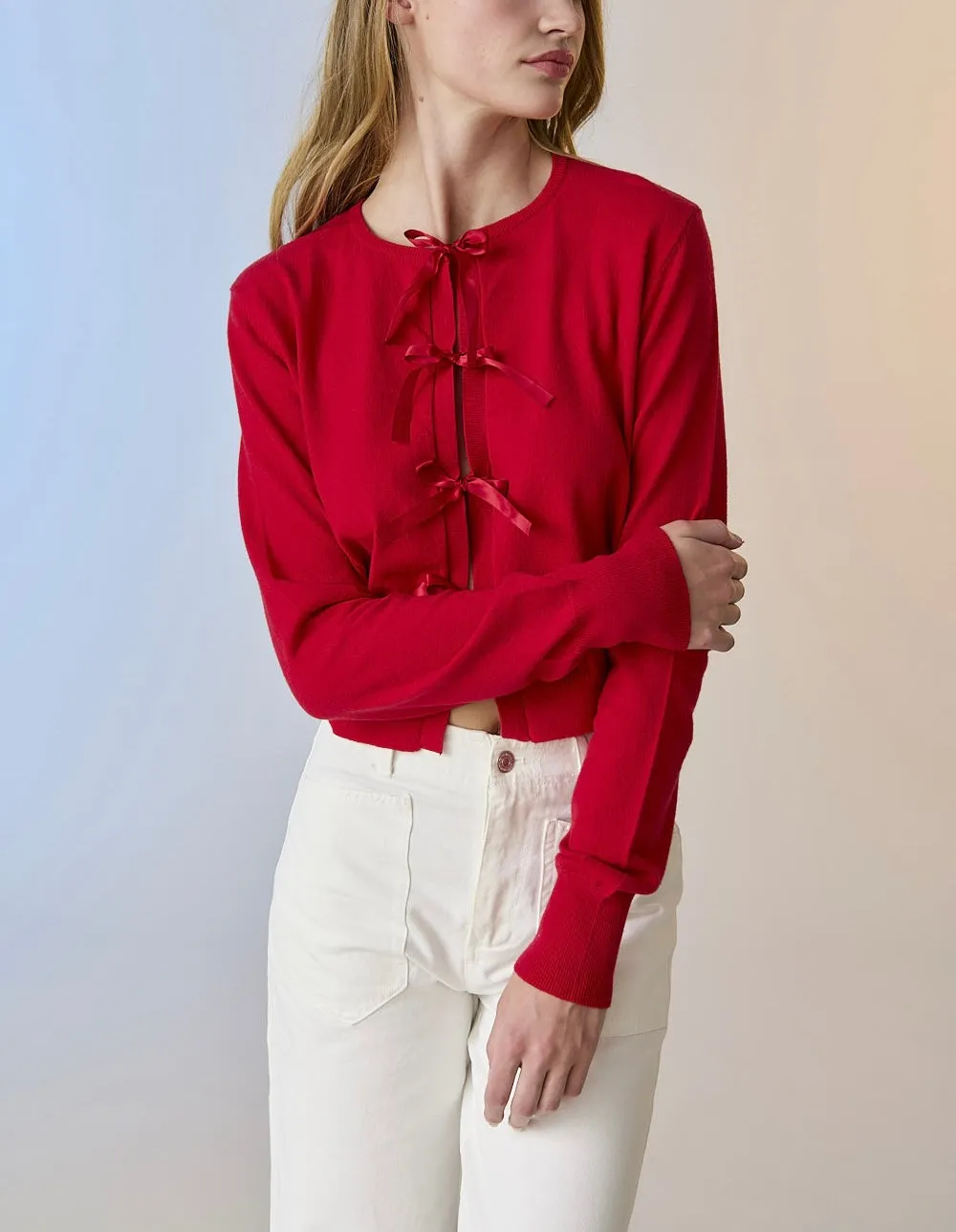 Red knit cardigan with bow detail