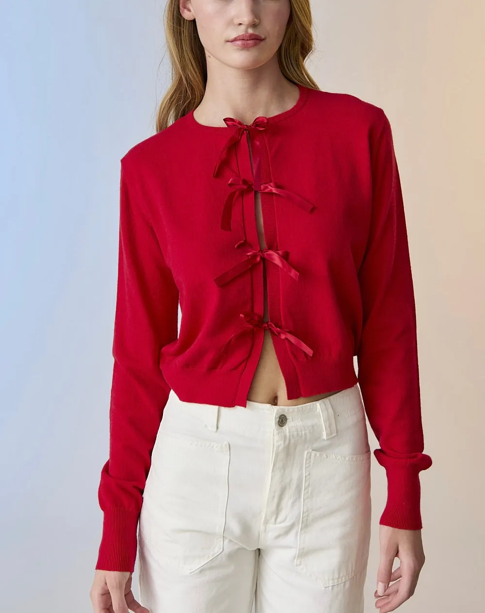 Red knit cardigan with bow detail